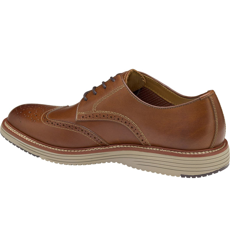 Johnston & Murphy Upton Wingtip shoes in tan leather with brogue detailing and cushioned sole, side view.