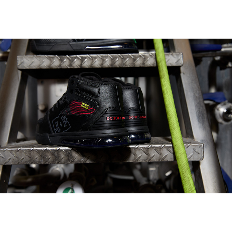 DC WorkCrew Versatile Work Hi Top Comp Toe work shoes in black with red mesh accents and composite toe, back view.