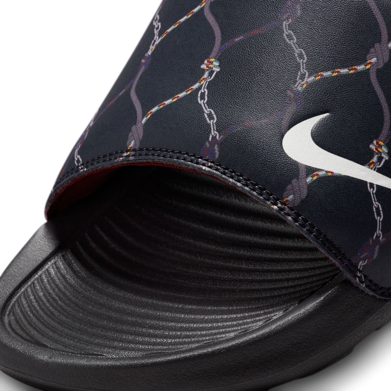 Nike Victori One Printed sandals in black with a chain-inspired multicolor graphic and white Nike logo, close-up view showing textured footbed.