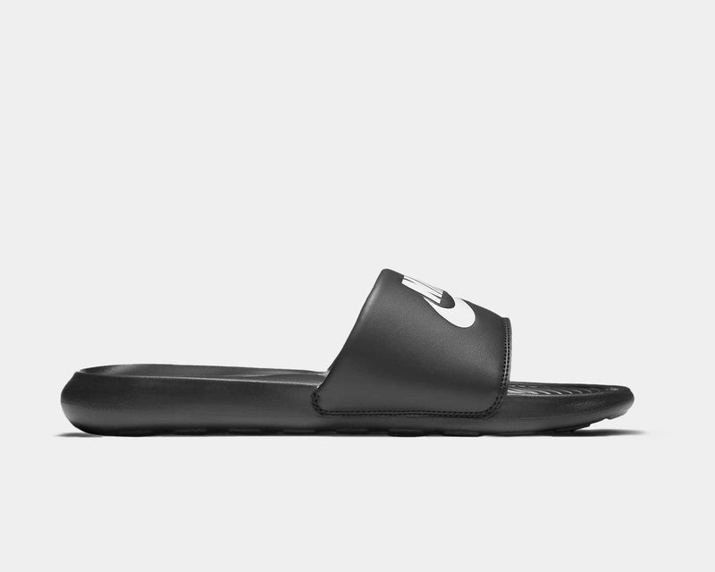 Black slide sandal with a brand logo on a light gray background