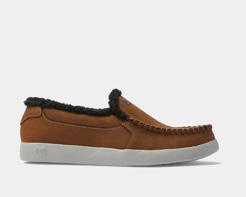 DC Footwear Villain 2 SE slip-on shoes in brown with moccasin stitching and black sherpa lining, side view.