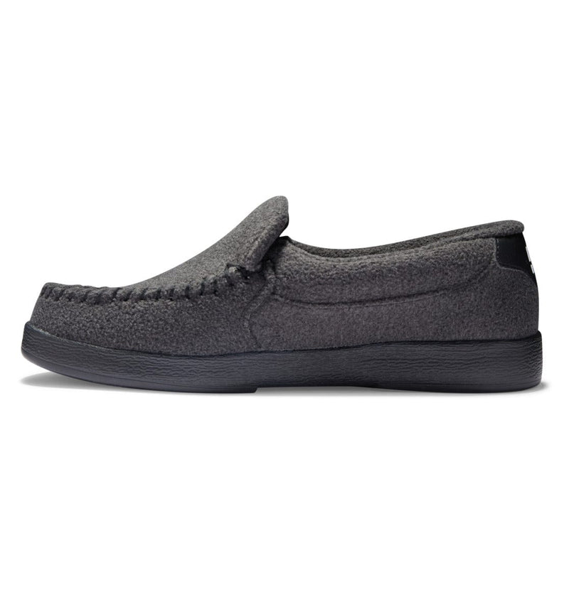 DC Footwear Villain 2 slip-on shoes in dark gray with textured fabric upper and black outsole, side view.