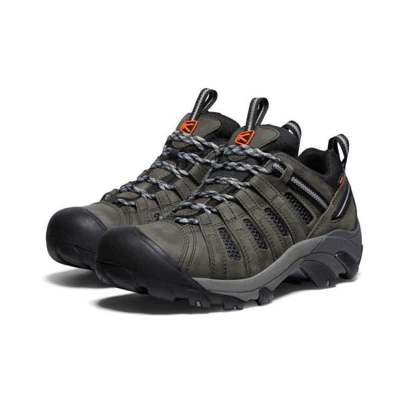 Keen Voyageur hiking shoes in olive green and black with durable leather and mesh upper, breathable design, and rugged outsole, front angle view.