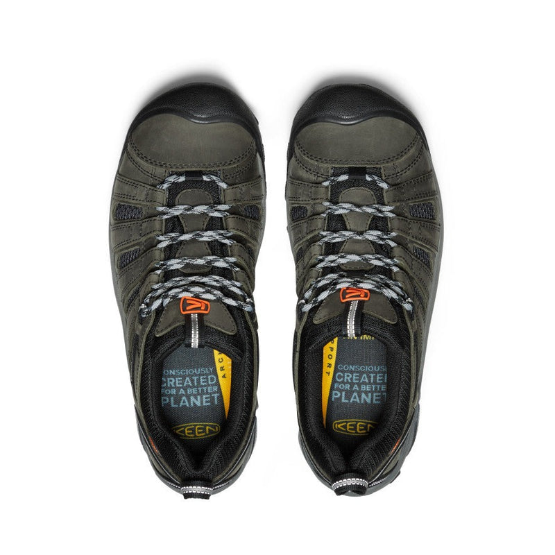 Keen Voyageur hiking shoes in olive green with black accents, durable mesh panels, and lace-up closure, top view.