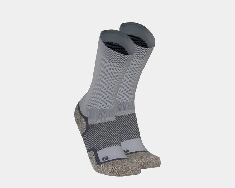 OS1st Wellness Performance Crew Socks in gray with arch support and moisture-wicking fabric, angled front view.