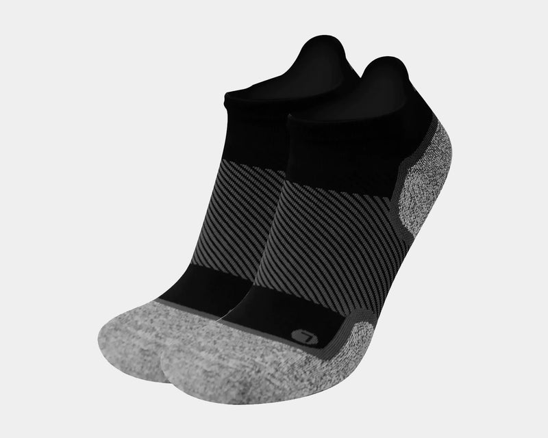 OS1st Wellness Performance No Show Socks in black and gray with striped compression zones and cushioned heel and toe, angled side view.