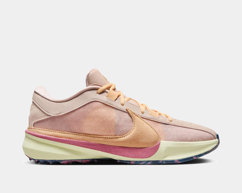 Nike Zoom Freak 5 basketball shoes in pastel pink, peach, and yellow with multi-textured upper and patterned outsole, side profile view.